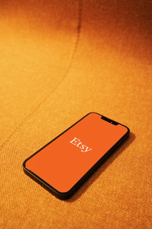 October 6, 2022: Etsy logo on smartphone screen. Focus on smartphone
