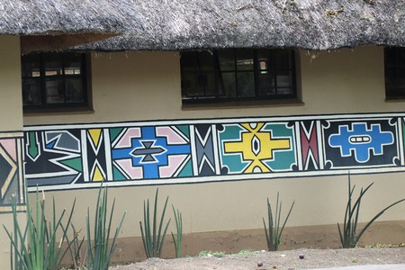 Thatch building with traditional art paintingsの写真素材