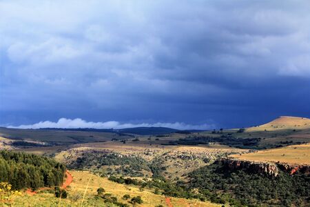Thunder clouds forming over the  mountainsの写真素材
