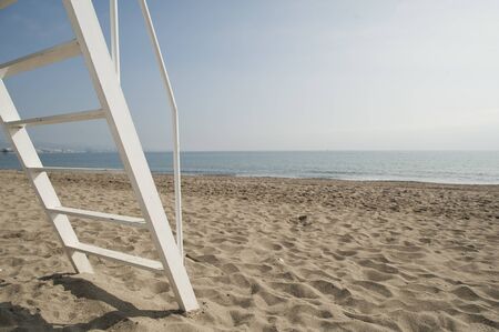 beach landscape with lifeguard ladder on the beach, and space to writeの写真素材