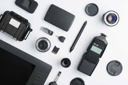 Flat assembly composition with photographic production equipment, with writing space, on white background. Top viewの写真素材