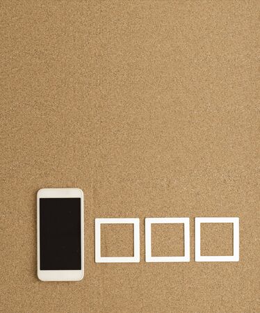 vacation, travel and summer vacation concept: smartphone with set of square photo frames. in the...