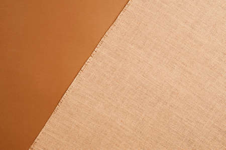 Natural linen texture, brown background.top view