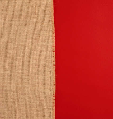 vertical Natural linen texture, red background top view.の写真素材