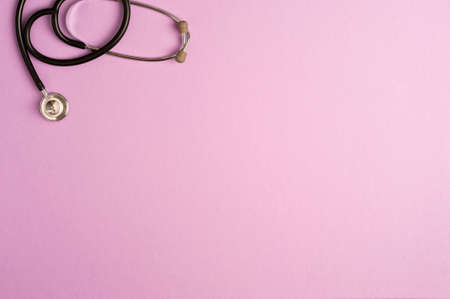 Medicine accessory, stethoscope, lilac background with copy space. top viewの写真素材