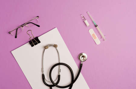 Covid-19 coronavirus concept. accessories medicine, prevention and vaccination coronavirus, lilac background with copy space. top viewの写真素材