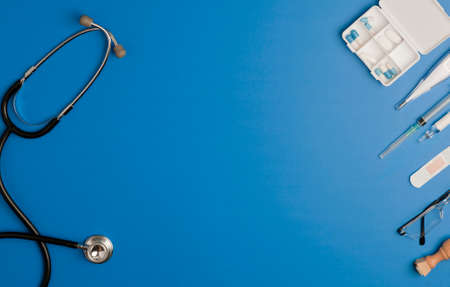 Covid-19 Coronavirus concept. accessories medicine, prevention and vaccination coronavirus, blue background with copy space. top viewの写真素材