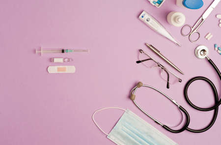Covid-19 Coronavirus concept. accessories medicine, prevention and vaccination coronavirus, lilac background with copy space. top viewの写真素材