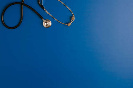 Medicine accessory, stethoscope, blue background with copy space. top viewの写真素材
