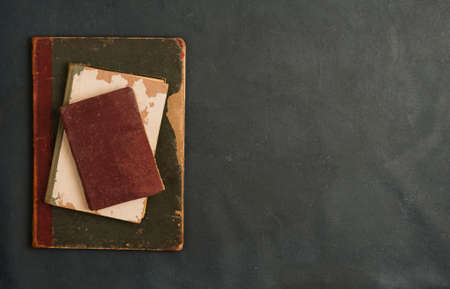 old books, on gray background. top view