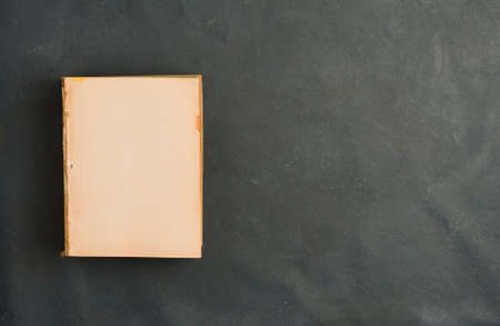 old books with smooth cover on gray background. top viewの写真素材