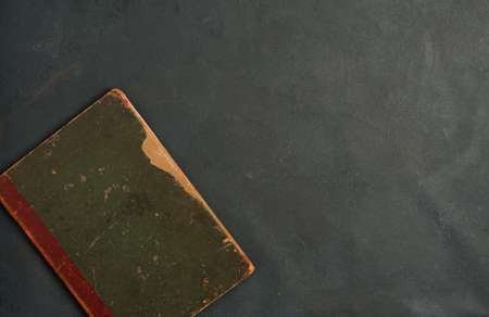 partial view of old book, on gray background. top viewの写真素材