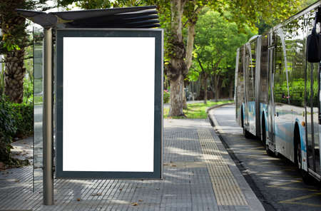 Blank advertising billboard mockup and template or light billboards with copy space for text or message and media content, Blank shadow billboards with display on city wall background with busの写真素材