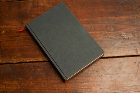 blue book on old wooden table