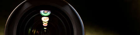Optical partial sight. Reflection in the photo, camera on blue background.
