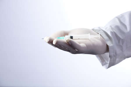 Syringe, medical injection in the hand, palm or fingers. Plastic vaccination kit with needle. Nurse...