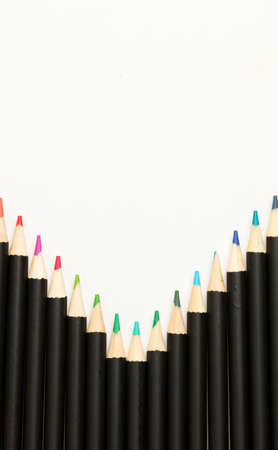 Black pencils with colored tips, white backgroundの写真素材