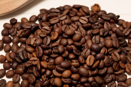 coffee beans, wooden spoon, white background