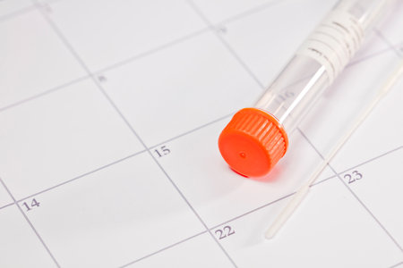 Rapid test kit, vial with orange cap and swab, sticker for patient data, with background calendar