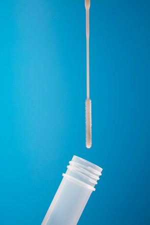 Swab for nasopharyngeal smear, with vital transport, (obtaining PCR analysis) with blue backgroundの写真素材