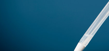 transport vial with swab inside, rapid SARS-CoV-2 antigen, blue backgroundの写真素材