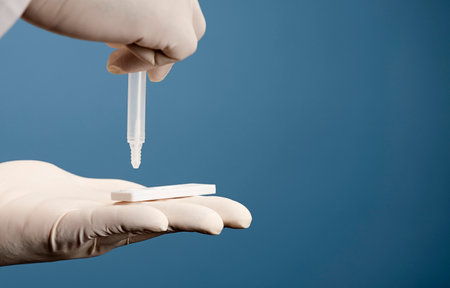 Doctor holding a test kit for viral disease tests with the COVID-19 SARS-CoV-2 laboratory card kit...