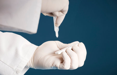 Doctor containing a COVID-19 2019-nCoV viral disease test kit. Sars-cov-2 viral coronavirus virus...
