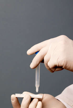 Physician who owns a COVID-19 antigen test kit with a COVID-19 2019-nCoV viral disease test kit....