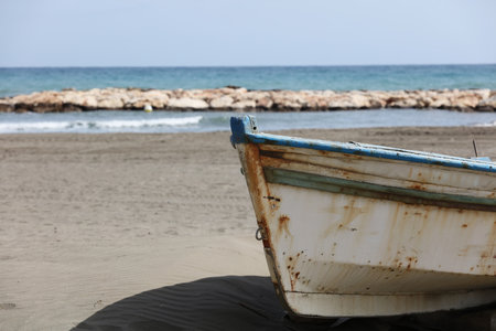 old fishing boat stranded on the sandの写真素材