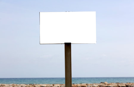 billboard on the beach with blue sky backgroundの写真素材