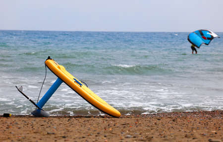 hydrofoil board on the sand, deep sea with windfoil kiteの写真素材