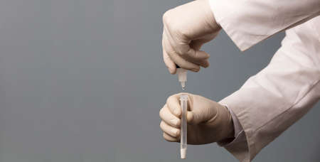 Physician who owns a COVID-19 antigen test kit with a COVID-19 2019-nCoV viral disease test kit. SARS-CoV-2 coronavirus virus lab card kit test. Rapid COVID-19 testの写真素材