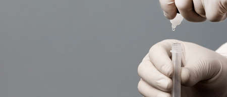 Physician who owns a COVID-19 antigen test kit with a COVID-19 2019-nCoV viral disease test kit. SARS-CoV-2 coronavirus virus lab card kit test. Rapid COVID-19 testの写真素材