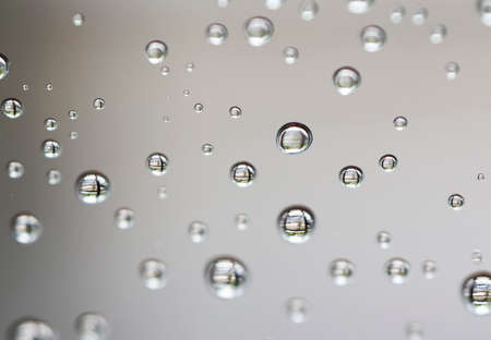 Water drops on the gray backgroundの写真素材