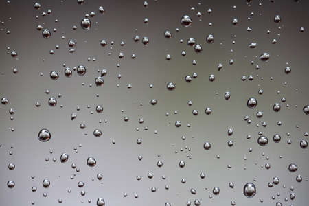 Water drops on the gray backgroundの写真素材