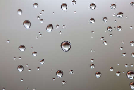 Water drops on the gray backgroundの写真素材