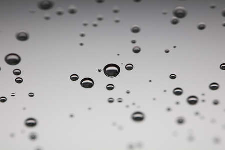 Water drops on the gray backgroundの写真素材