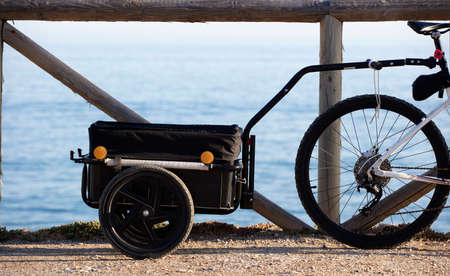 bikepacking, luggage rack with bicycle, sea backgroundの写真素材