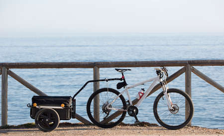 bikepacking, luggage rack with bicycle, sea backgroundの写真素材