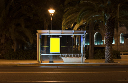 Billboard with light in the center of the city at nightの写真素材