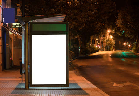 Billboard with light in the center of the city at nightの写真素材