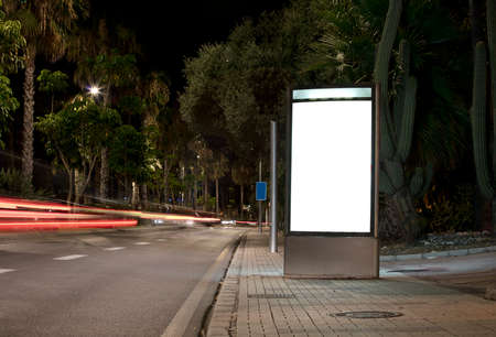 Billboard with light in the center of the city at nightの写真素材