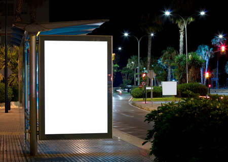 Billboard with light in the center of the city at nightの写真素材