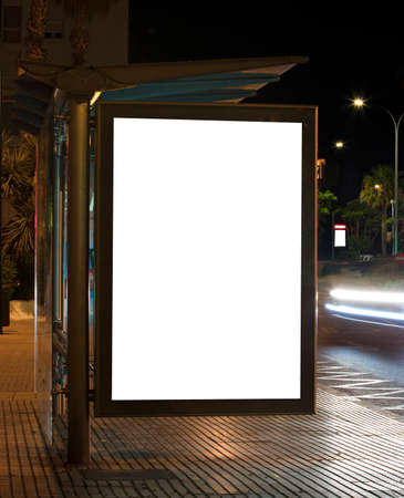 Billboard with light in the center of the city at nightの写真素材