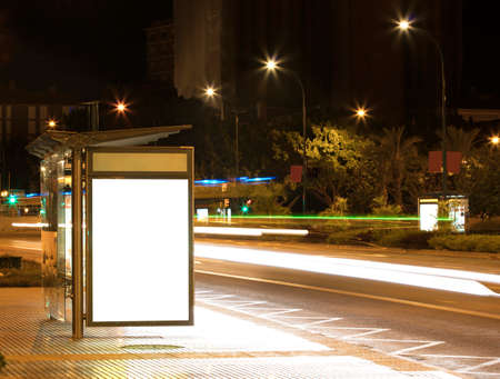 Billboard with light in the center of the city at nightの写真素材