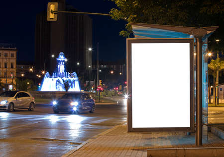 Billboard with light in the center of the city at nightの写真素材