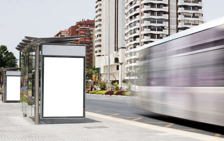 Billboard in the city center, with bus in motionの写真素材