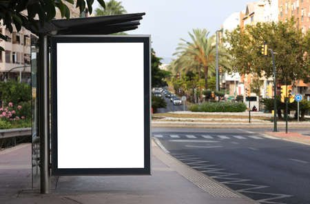 White crumpled poster template. Twisted paper mockery. Blank wheat pasta on the textured wall. An empty street art sticker mocks. Advertising canvas with urban glue. Cardboard ad poster.の写真素材
