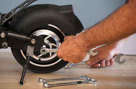 Electric motorcycle maintenance service concept. Repair service. Technological concept.の写真素材