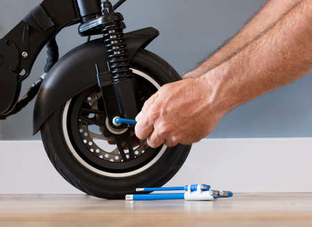 Electric motorcycle maintenance service concept. Repair service. Technological concept.の写真素材